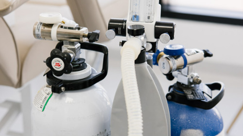 Nitrous oxide and oxygen gas cylinders with regulators used for happy gas dental sedation